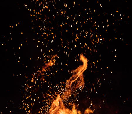 Burning sparks flying. Beautiful flames background.の写真素材