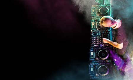 Dj mixes the track in the nightclub at a partyの写真素材