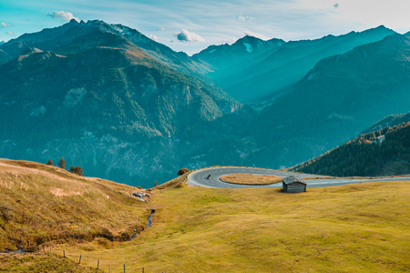Motorcycle driver riding in Alpine highway, Hochalpenstrasse, Austria, Europe.の写真素材