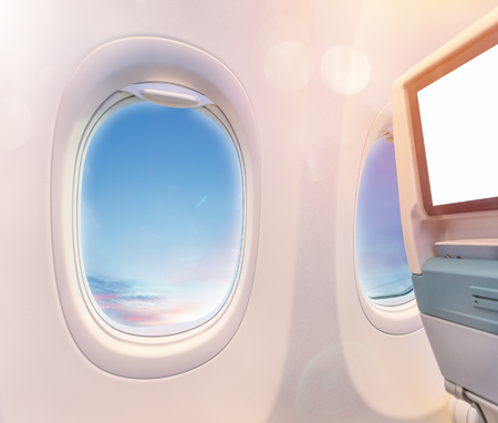 Beautiful sunset with cloudy sky from the airplane window.