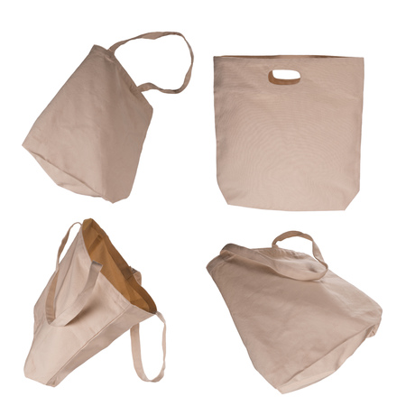 Collection of light beige cotton bags on white background.の写真素材
