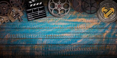 Cinema concept of vintage film reels, clapperboard and projector.の写真素材