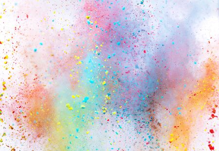Colored powder explosion on white background.