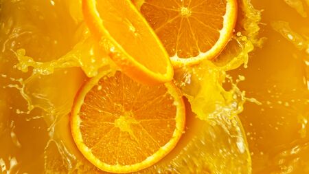 Freeze motion of pouring orange juice. Top view, close-up.の写真素材