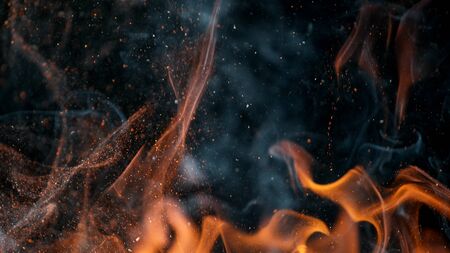 fire flames with sparks on a black background, close-upの写真素材