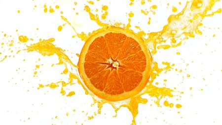 Freeze motion of sliced orange with splashing juice isolated on white backgroundの写真素材