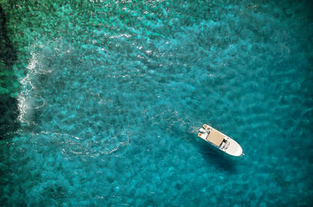 Speed boat in mediterranean sea, aerial viewの写真素材