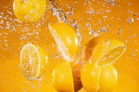 Fresh Orange Slices with Splashing Juiceの写真素材