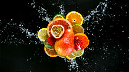 Freeze Motion Shot of Fresh Fruits with Splashing Waterの写真素材
