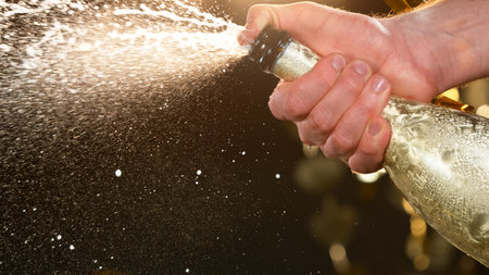 Champagne explosion with splashing liquidの写真素材