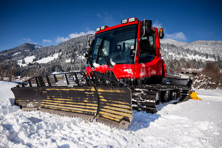 Piste machine (snow cat) on the mountainsの写真素材
