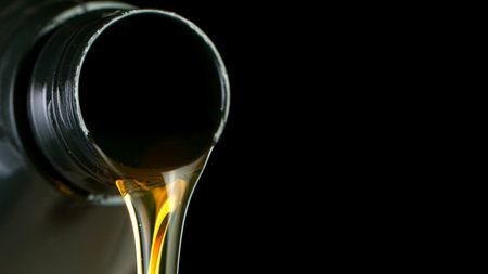 Pouring Fresh New Motor Oil into Cars Engine.の写真素材
