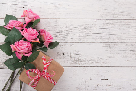 Flowers composition for Valentines, Mothers or Womens Day. Pink flowers on old white wooden background.の写真素材