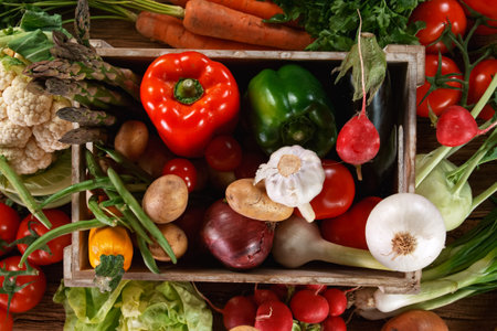 Fresh organic vegetables in a wooden box.の写真素材