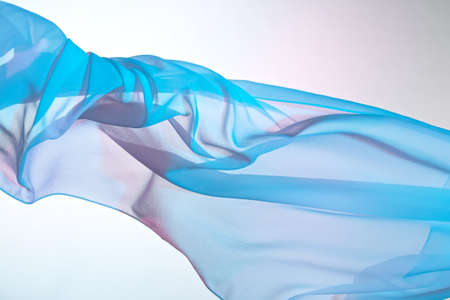 Smooth elegant colorful transparent cloth separated on white background.