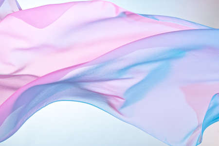 Smooth elegant colorful transparent cloth separated on white background.