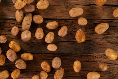 Fresh harvested potatoes in a wooden box.の写真素材