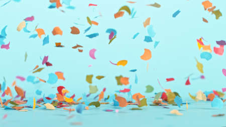 Color confetti falling on pastel blue backgroundの写真素材