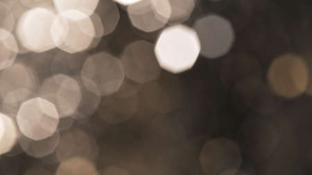 Abstract gold particles on black background.の写真素材