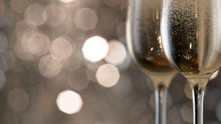 Champagne bubbles in glass flutes.の写真素材