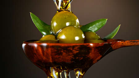 Fresh Green Olives with Pouring Oil.の写真素材