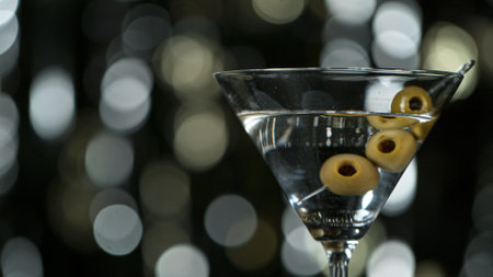 Falling olives into martini drinkの写真素材