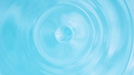 Water splash isolated on light blue background