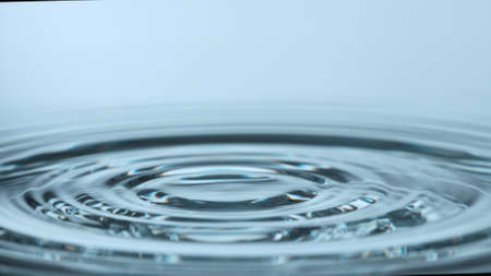 Water splash isolated on light blue background