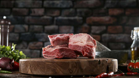 Close-up of falling salt and pepper on tasty beef steakの写真素材