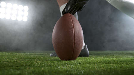 American Football Player Kicking Ballの写真素材