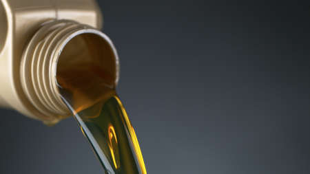 Pouring Oil from Plastic Containerの写真素材