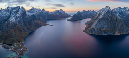 Sunset aerial panoramic view on sharp mountain peaks of Lofoten islands, Norway