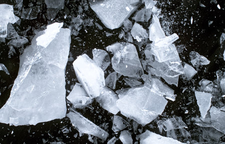 Abstract ice texture. A network of cracks on a piece of blue ice