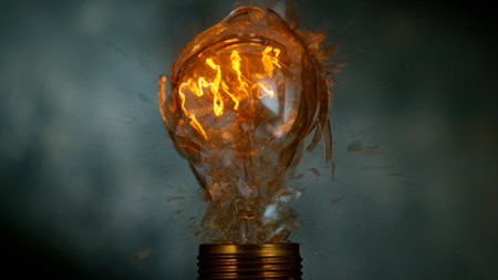 Freeze motion of light bulb exploding, dark backgroundの写真素材