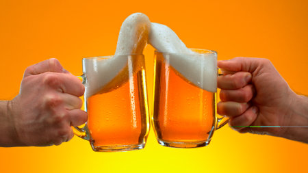 Freeze Motion Shot of Clinking Two Glasses of Beer, Close-upの写真素材