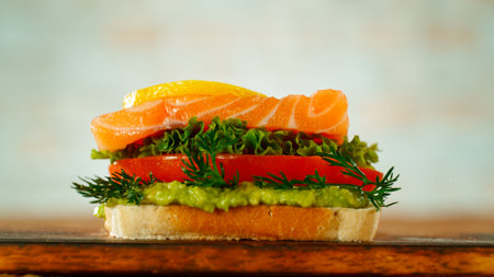 Fresh Tasty Sandwich with Salmon, Avocado, Dill, and Tomato, Close-upの写真素材