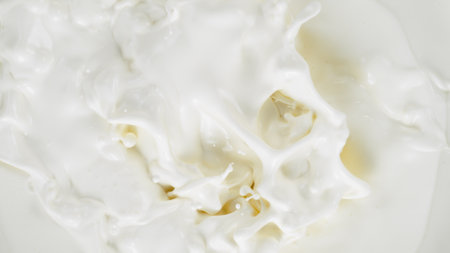 Freeze motion of whirling milk cream, close-upの写真素材