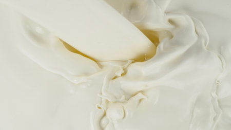 Freeze motion of whirling milk cream, close-upの写真素材