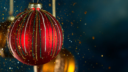 Decorative Christmas Balls with Bokeh Lights and Glitters Fallingの写真素材