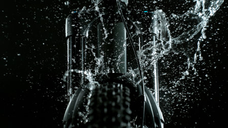 Mountain Bike Suspension Fork on Dark Background with Water Splash, Studio Shotの写真素材