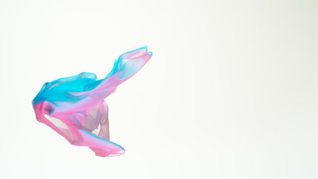 Pastel color transparent silk fabric flowing by wind, close-up