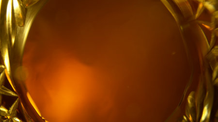 Freeze Motion Shot of Whiskey Liquid Pouring, Macro, Unique Angle of View from the Bottom of the Glassの写真素材