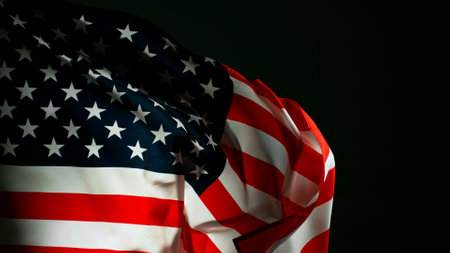 Closeup of American flag on black background, freeze motion
