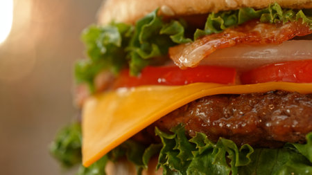 Close-up of home made tasty burgers on old olive wooden table.の写真素材