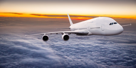 Passengers commercial airplane flying above clouds in sunset light. Concept of fast travel, holidays...