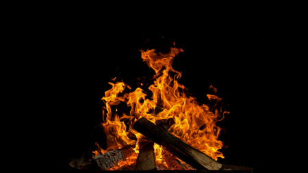 Freeze motion of campfire flames isolated on black backgroundの写真素材