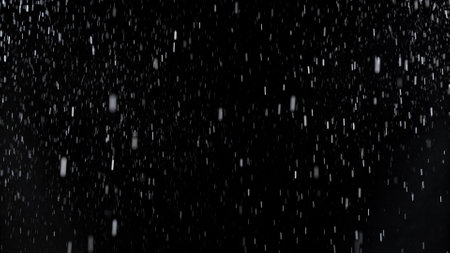 Freeze Motion of Rain - Falling Water Drops Isolated on Black Backgroundの写真素材