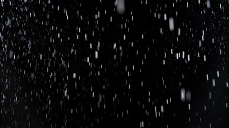Freeze Motion of Rain - Falling Water Drops Isolated on Black Backgroundの写真素材