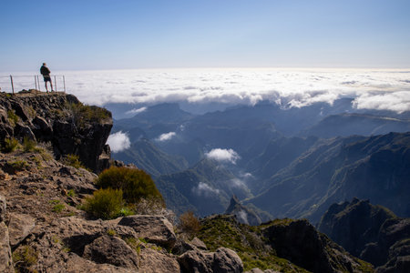 Epic View on mountain peaks with clouds rolling in the valley in Madeira