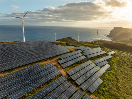 Solar energy panels photovoltaic cell and wind power plants on the seashore landscape for production of renewable green energyの写真素材